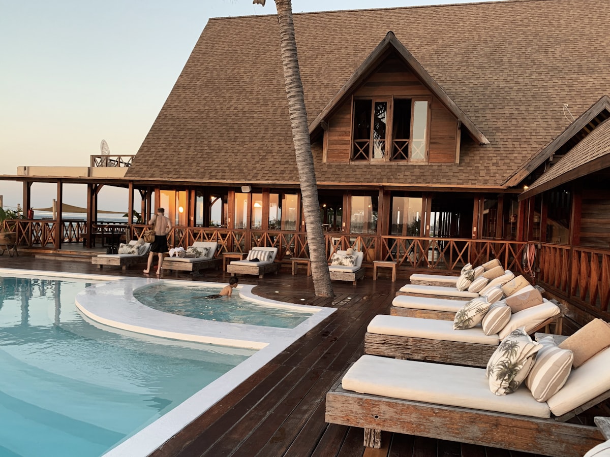 The Country Club Of Colorado clubhouse exterior surrounded by Ponderosa Pines